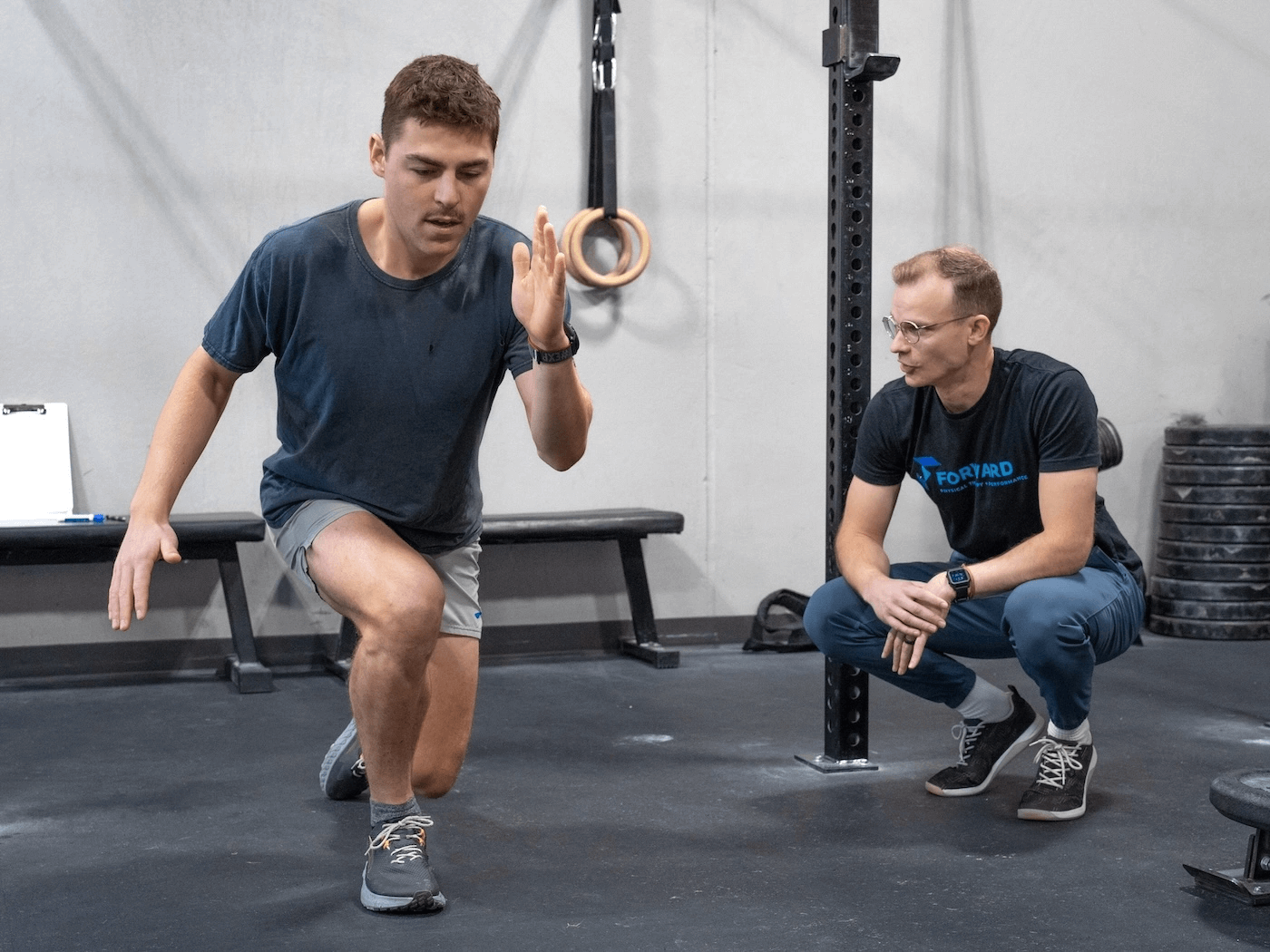 A man does lunges as part of physical therapy