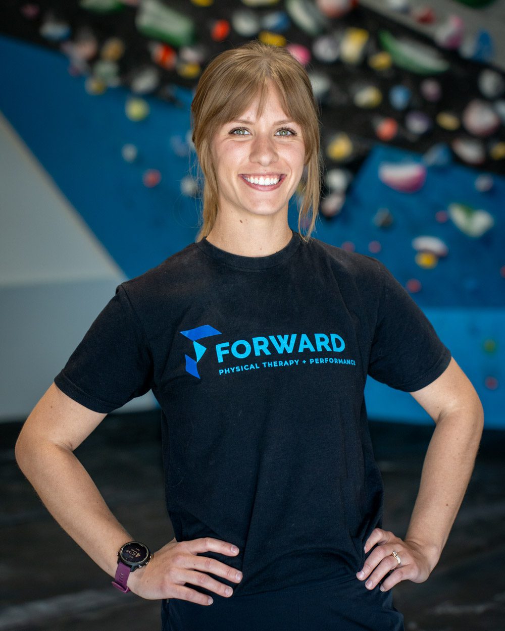 Anna Seibel with a Forward Omaha Physical Therapy and Performance shirt